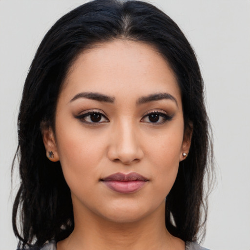 Neutral latino young-adult female with long  black hair and brown eyes