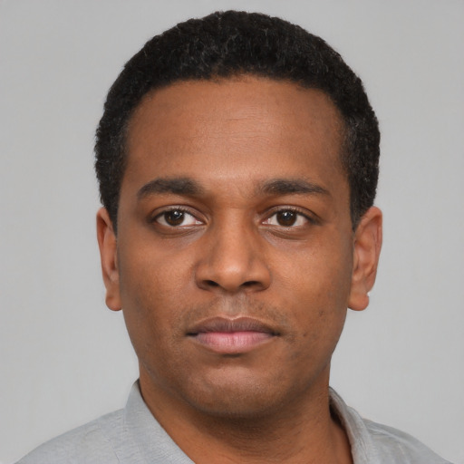 Neutral black young-adult male with short  black hair and brown eyes