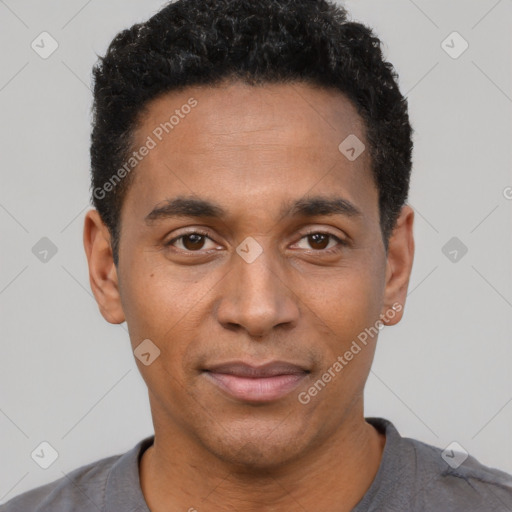 Joyful black young-adult male with short  black hair and brown eyes