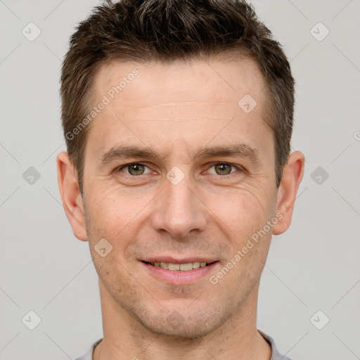 Joyful white adult male with short  brown hair and brown eyes