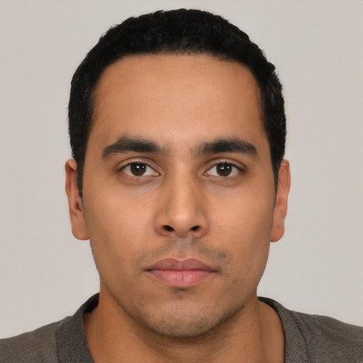 Neutral latino young-adult male with short  black hair and brown eyes