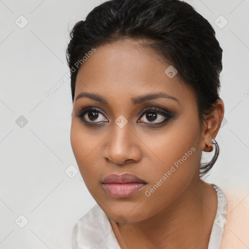 Joyful latino young-adult female with medium  brown hair and brown eyes