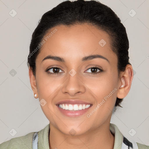 Joyful latino young-adult female with short  brown hair and brown eyes