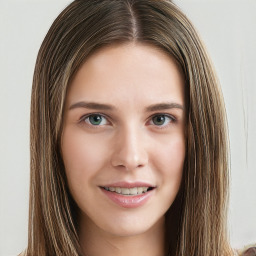 Joyful white young-adult female with long  brown hair and green eyes