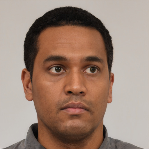 Neutral black young-adult male with short  black hair and brown eyes