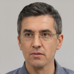 Neutral white middle-aged male with short  black hair and brown eyes