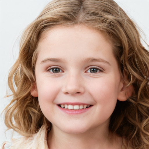 Joyful white child female with medium  brown hair and blue eyes