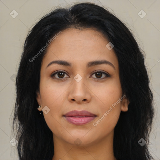 Joyful latino young-adult female with long  brown hair and brown eyes