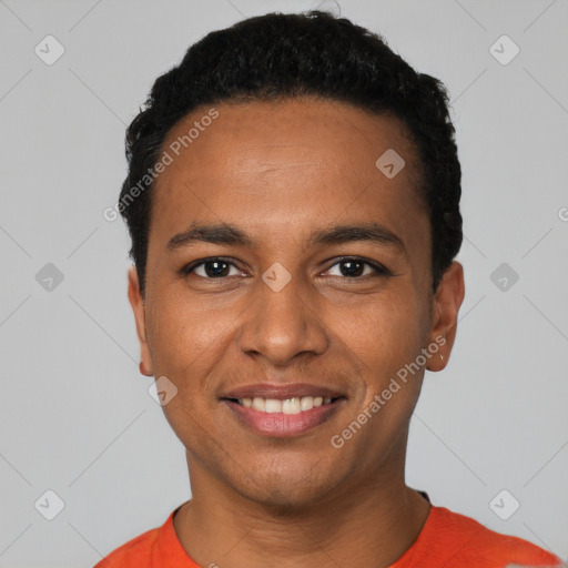 Joyful black young-adult male with short  black hair and brown eyes