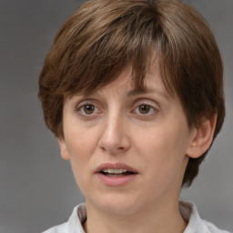 Joyful white adult female with short  brown hair and brown eyes