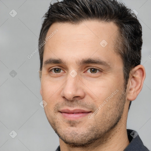 Joyful white young-adult male with short  brown hair and brown eyes