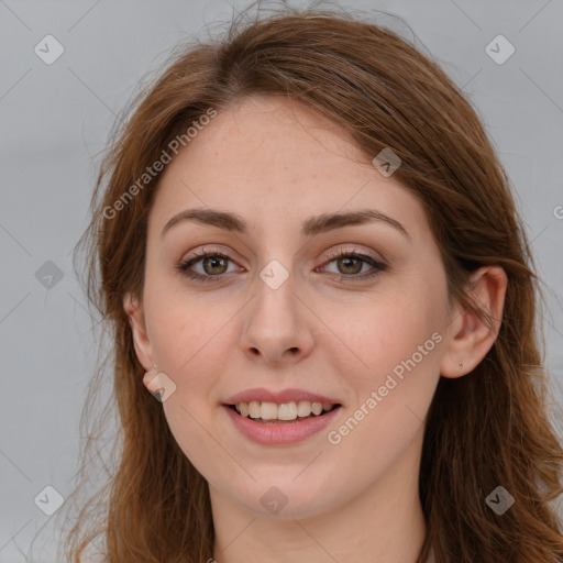 Joyful white young-adult female with long  brown hair and green eyes