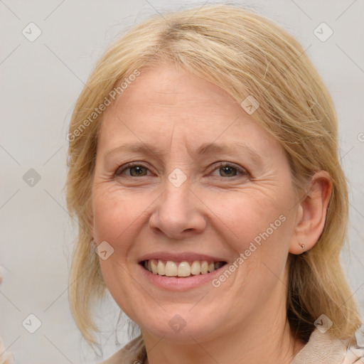 Joyful white adult female with medium  brown hair and brown eyes