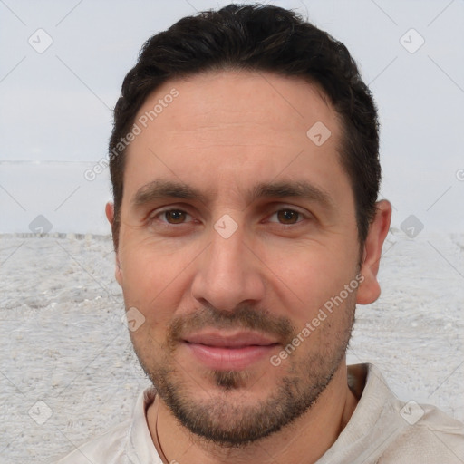 Joyful white young-adult male with short  black hair and brown eyes