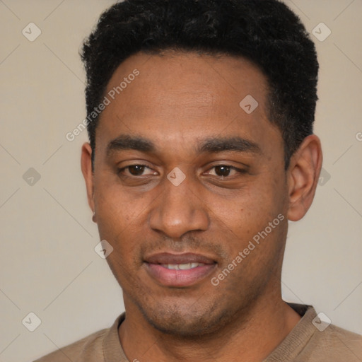 Joyful black young-adult male with short  black hair and brown eyes