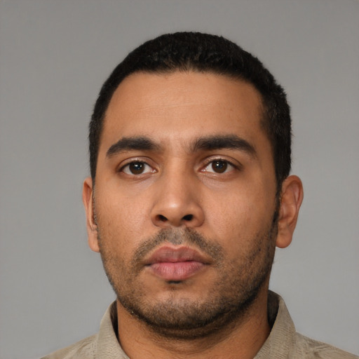 Neutral latino young-adult male with short  black hair and brown eyes