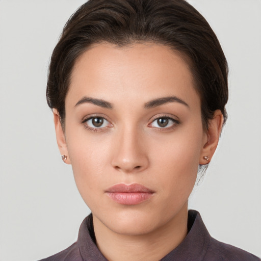 Neutral white young-adult female with short  brown hair and brown eyes