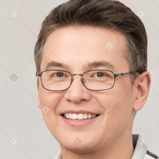 Joyful white adult male with short  brown hair and grey eyes