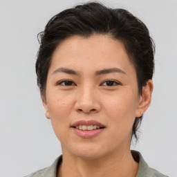 Joyful asian young-adult female with short  brown hair and brown eyes