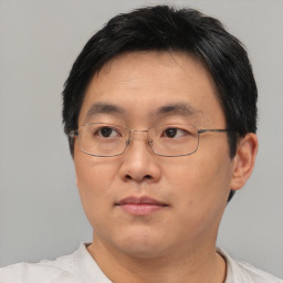 Neutral asian adult male with short  brown hair and brown eyes