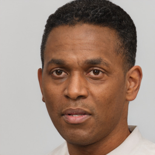 Neutral latino adult male with short  black hair and brown eyes