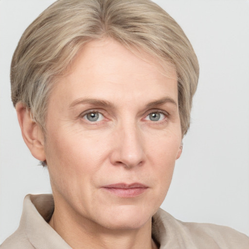 Joyful white adult female with short  brown hair and grey eyes