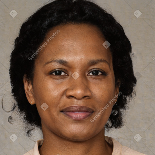 Joyful black adult female with short  brown hair and brown eyes