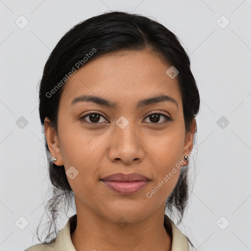 Joyful latino young-adult female with medium  black hair and brown eyes