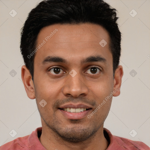 Joyful white young-adult male with short  black hair and brown eyes