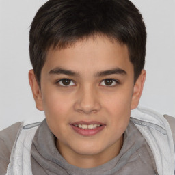 Joyful white child male with short  brown hair and brown eyes