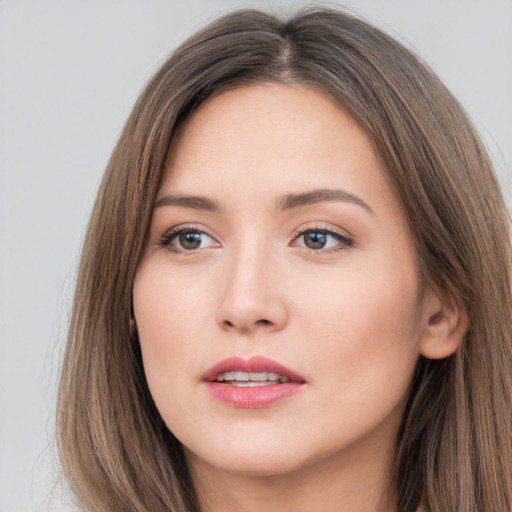 Neutral white young-adult female with long  brown hair and brown eyes