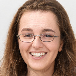 Joyful white adult female with long  brown hair and grey eyes