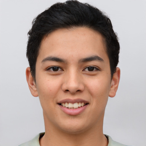 Joyful asian young-adult male with short  brown hair and brown eyes