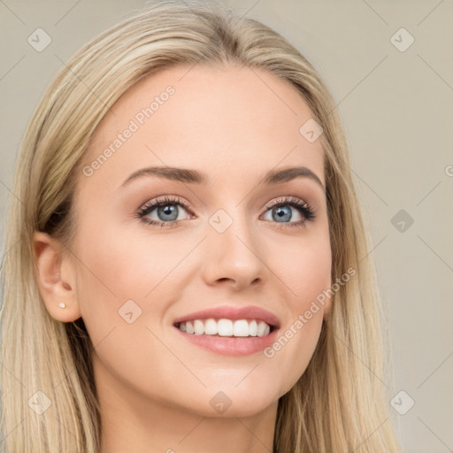 Joyful white young-adult female with long  brown hair and blue eyes