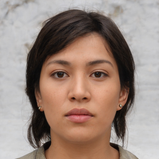 Neutral asian young-adult female with medium  brown hair and brown eyes