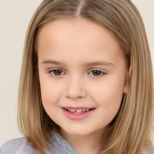 Joyful white child female with long  brown hair and brown eyes