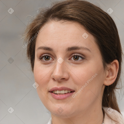 Joyful white adult female with medium  brown hair and brown eyes