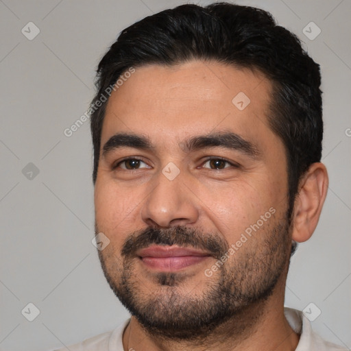 Joyful white young-adult male with short  black hair and brown eyes