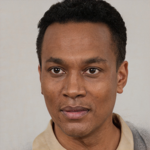 Neutral black adult male with short  black hair and brown eyes