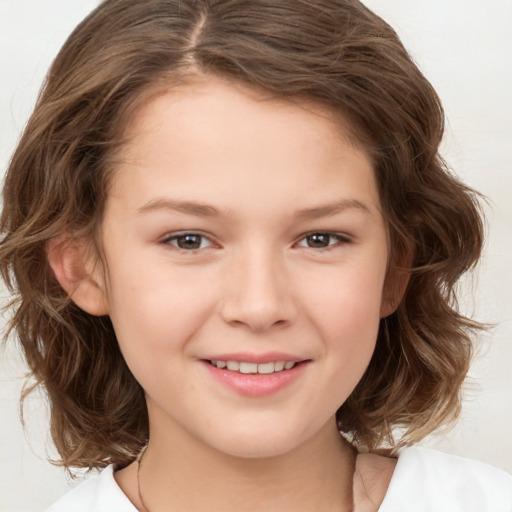 Joyful white child female with medium  brown hair and brown eyes