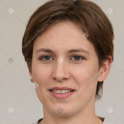 Joyful white young-adult female with short  brown hair and grey eyes