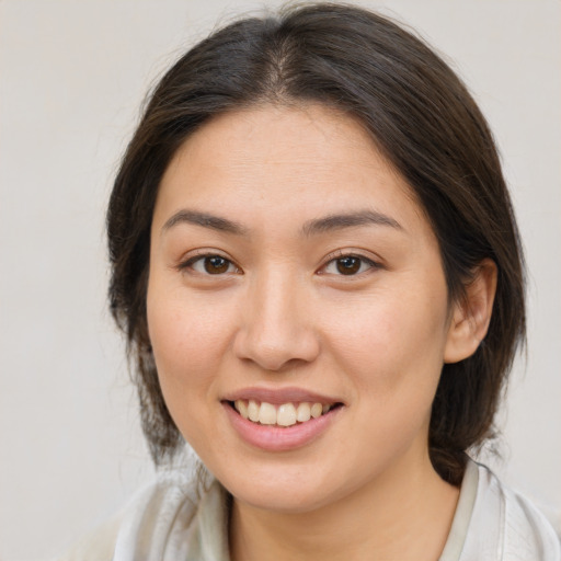 Joyful white young-adult female with medium  brown hair and brown eyes