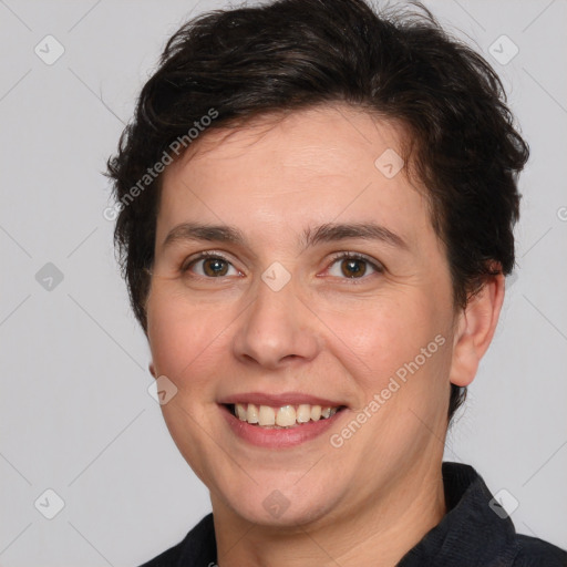 Joyful white adult female with short  brown hair and brown eyes