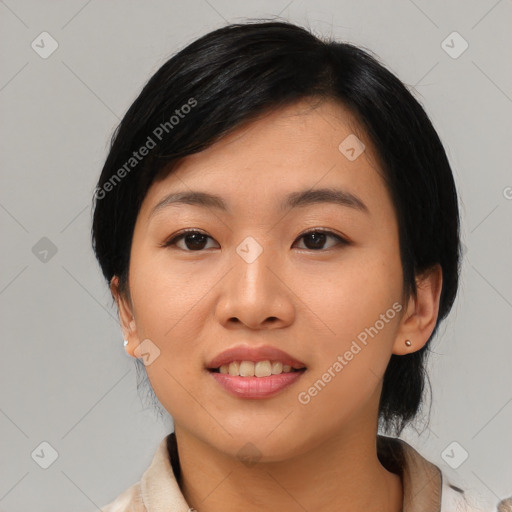 Joyful asian young-adult female with medium  black hair and brown eyes