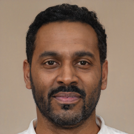 Neutral latino adult male with short  black hair and brown eyes