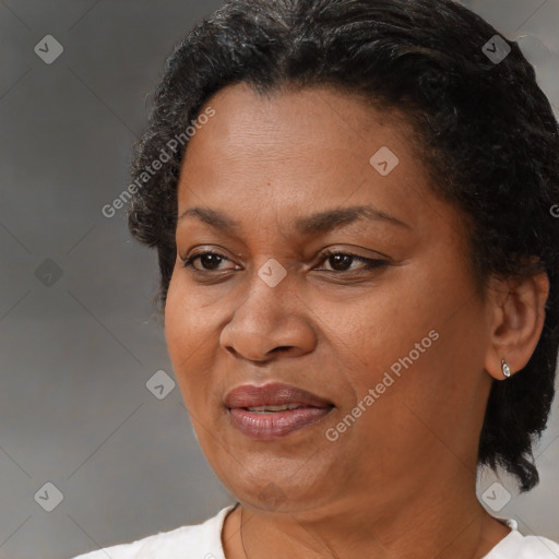 Joyful black adult female with short  brown hair and brown eyes