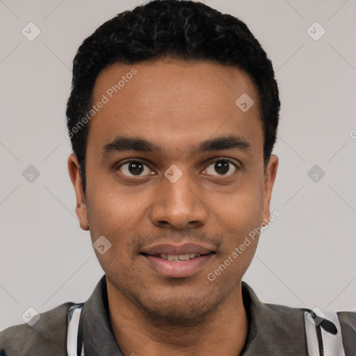 Joyful latino young-adult male with short  black hair and brown eyes