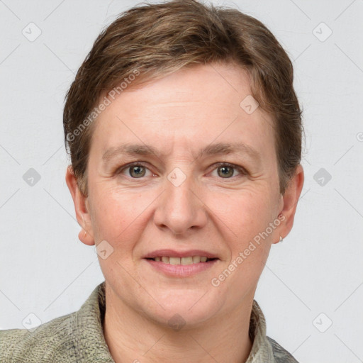 Joyful white adult female with short  brown hair and grey eyes