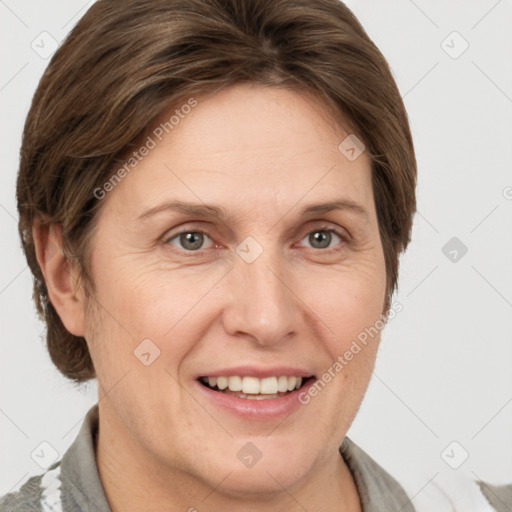 Joyful white adult female with short  brown hair and grey eyes