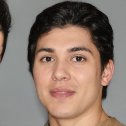 Joyful white young-adult male with medium  brown hair and brown eyes